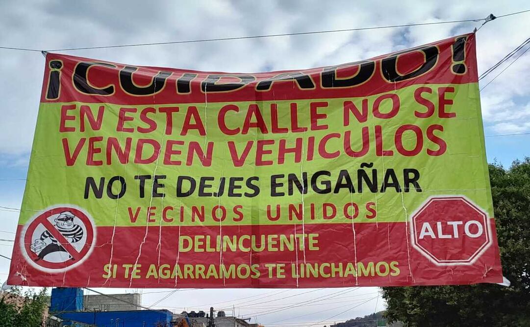 A través de lonas vecinos de la colonia Nueva Oxtotitlán, alertan a las personas sobre posibles estafas y asaltos en la zona. Foto: Claudia Rodríguez / El Universal Estado de México