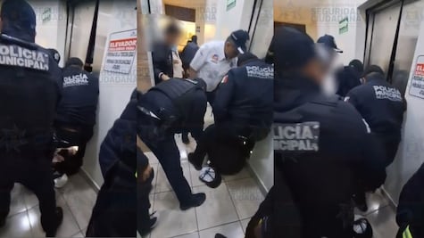 Bomberos y policías de Neza rescatan a familia atrapada en elevador